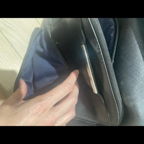 Tumi backpack in black leather